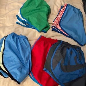 5 pairs of Nike Dri Fit shorts.
